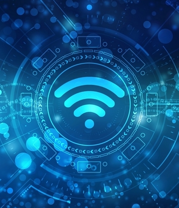 A glowing blue Wi-Fi symbol is centered on a digital, futuristic background with circular patterns, geometric shapes, and abstract technology elements.